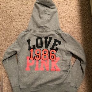 Victoria’s pink sweatshirt